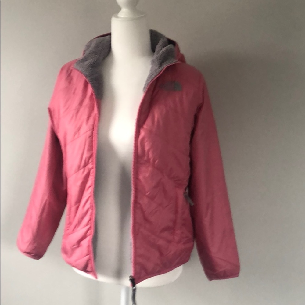 Girls Pink/grey North face reversible jacket.